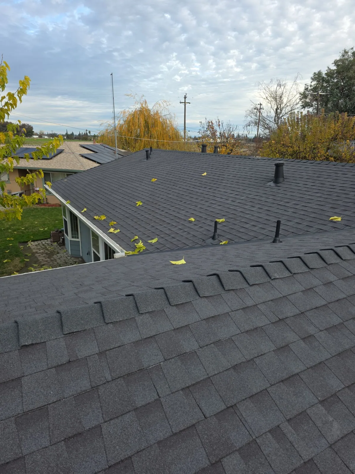 Atwater home after complete re-roof — clean new shingle roof