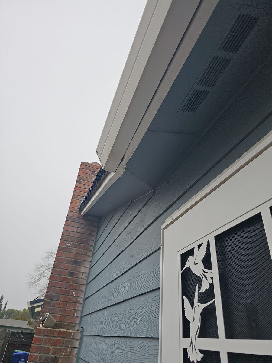 Hidden 2x6 dry rot at soffit and fascia transition on the back side of a residential roof in Atwater CA — diagnostic photo by Econo Roofing showing structural damage exposed during full tear-off.
