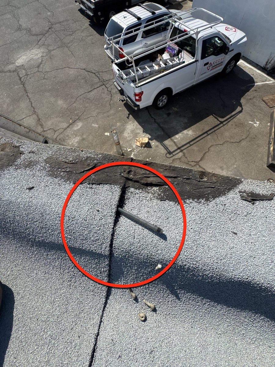 Roof inspection finding circled in red on a flat roof seam