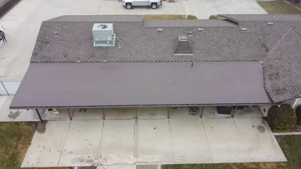Aerial view of a flat commercial roof completed by Econo Roofing