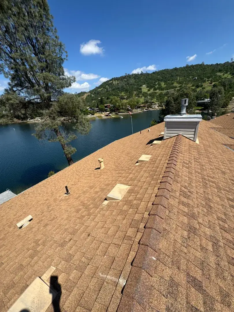 Jamestown home before roof replacement — deteriorated old roofing