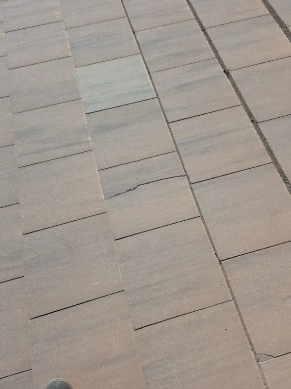 Livingston tile roof before leak repair — damaged tiles around the leak