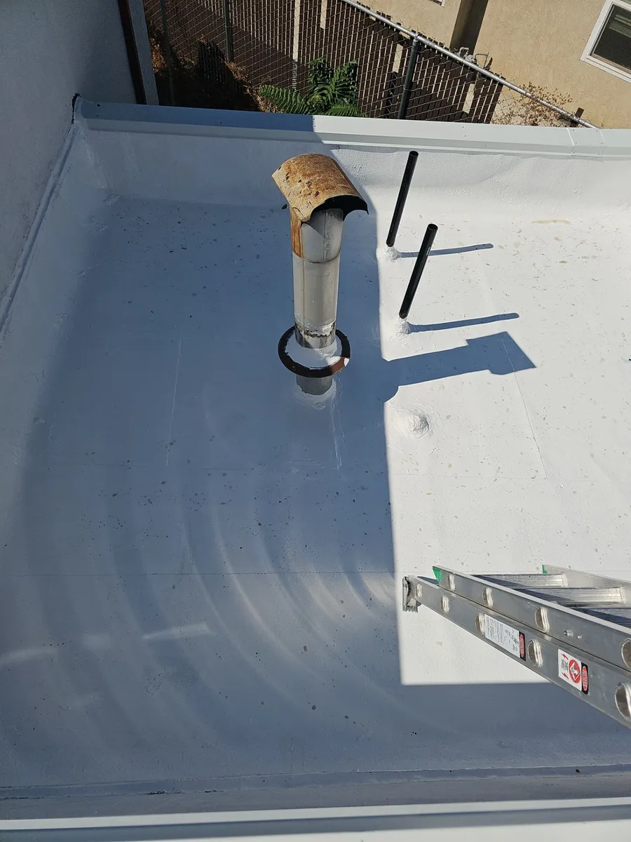 Beto's Bakery in Modesto after roof coating — finished sealed commercial flat roof