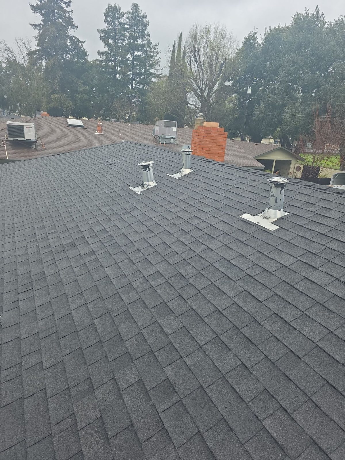 Completed roof after a full Econo repair in Turlock, aerial view